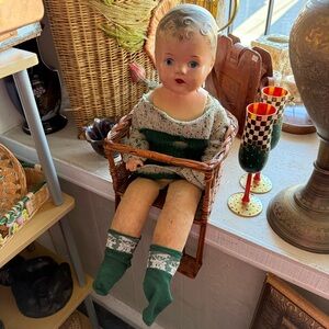 Antique Doll with Antique Wicker Chair